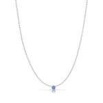 A Single Birthstone Layering Necklace - White Gold in Tanzanite on a white background.