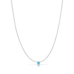 A Single Birthstone Layering Necklace - White Gold in Turquoise on a white background.