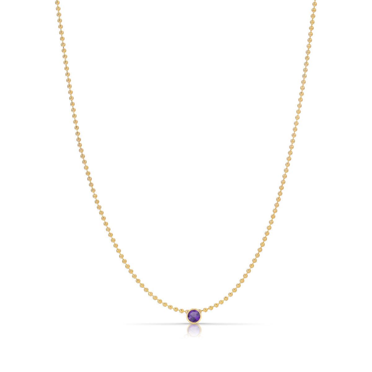 A Single Birthstone Layering Necklace - Yellow Gold in Amethyst - February on a white background.