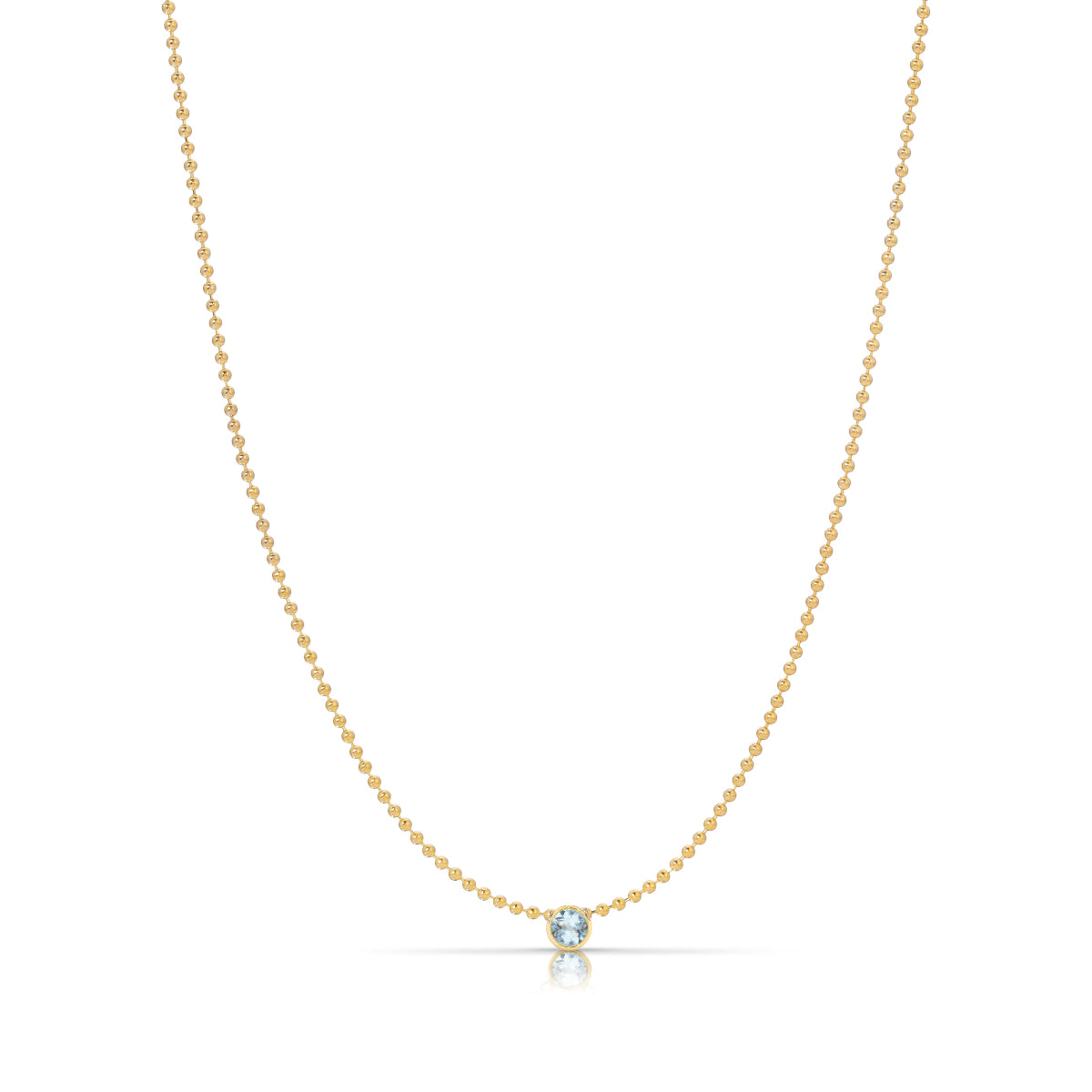 A Single Birthstone Layering Necklace - Yellow Gold in Aquamarine - March on a white background.
