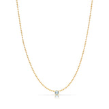 A Single Birthstone Layering Necklace - Yellow Gold in Aquamarine - March on a white background.