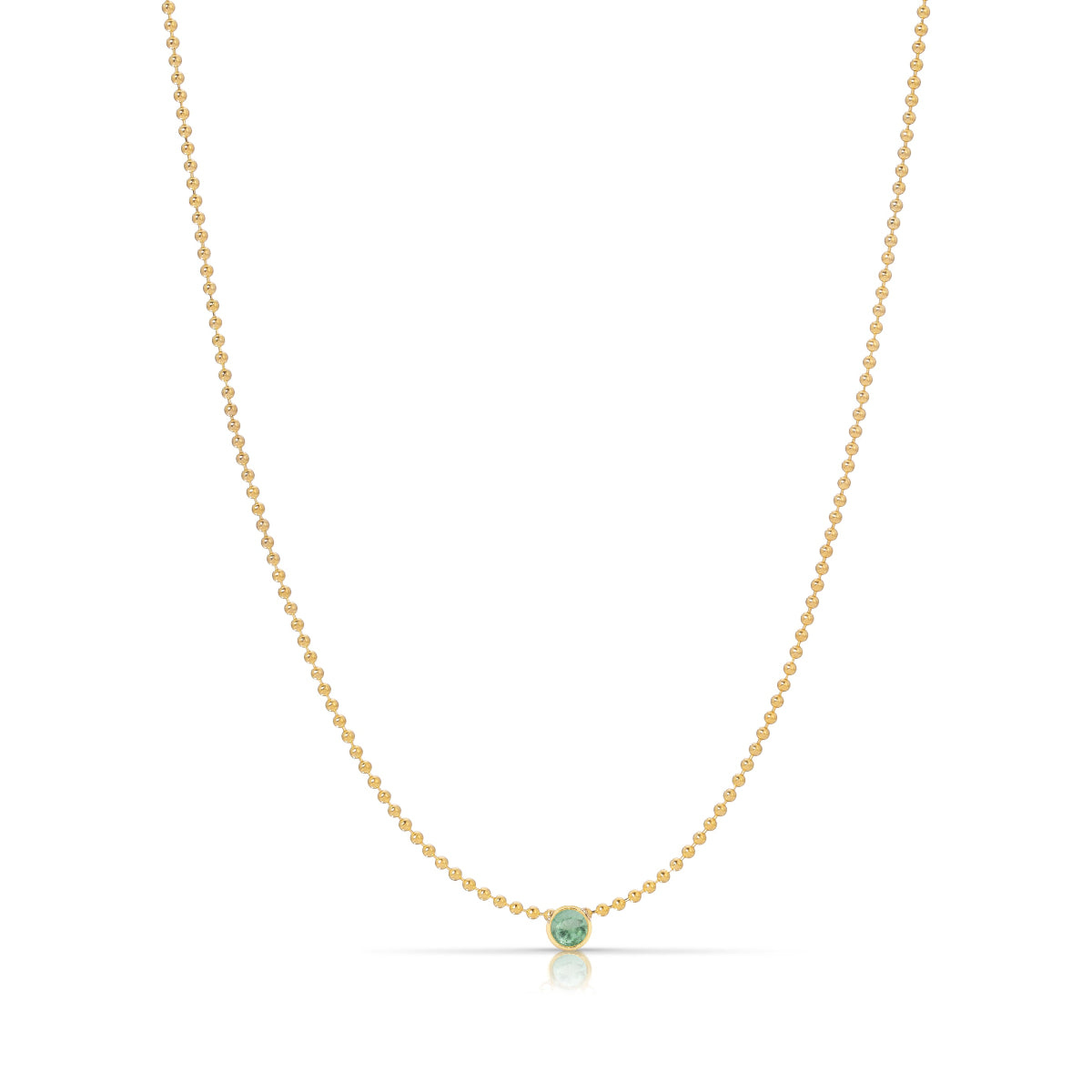 A Single Birthstone Layering Necklace - Yellow Gold in Emerald - May on a white background.