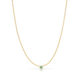 A Single Birthstone Layering Necklace - Yellow Gold in Emerald - May on a white background.