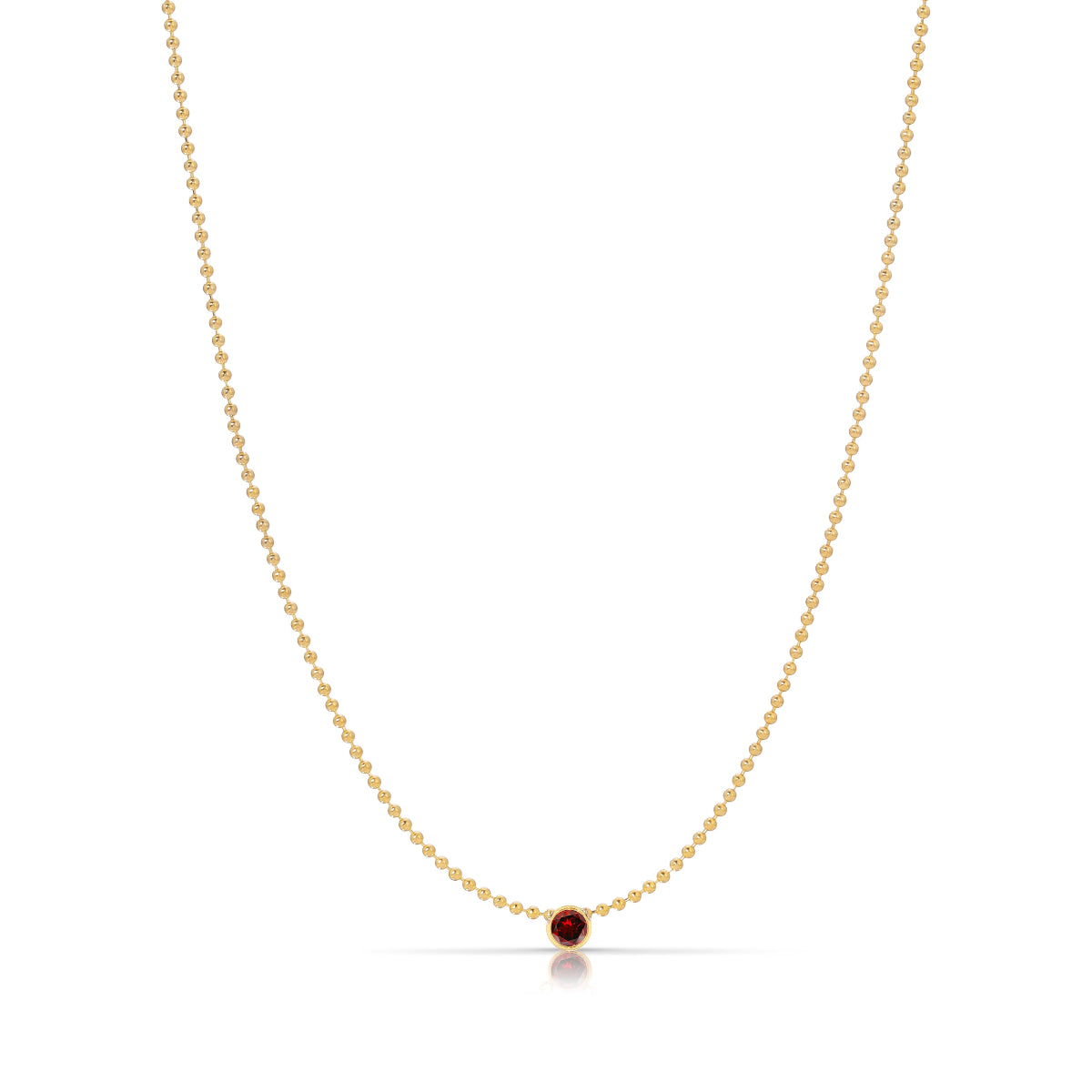 A Single Birthstone Layering Necklace - Yellow Gold in Garnet - January on a white background.