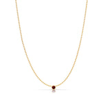 A Single Birthstone Layering Necklace - Yellow Gold in Garnet - January on a white background.