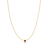 A Single Birthstone Layering Necklace - Yellow Gold in Garnet - January on a white background.