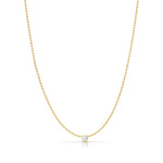 A Single Birthstone Layering Necklace - Yellow Gold in Opal - October on a white background. 