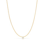 A Single Birthstone Layering Necklace - Yellow Gold in Pearl - June on a white background.