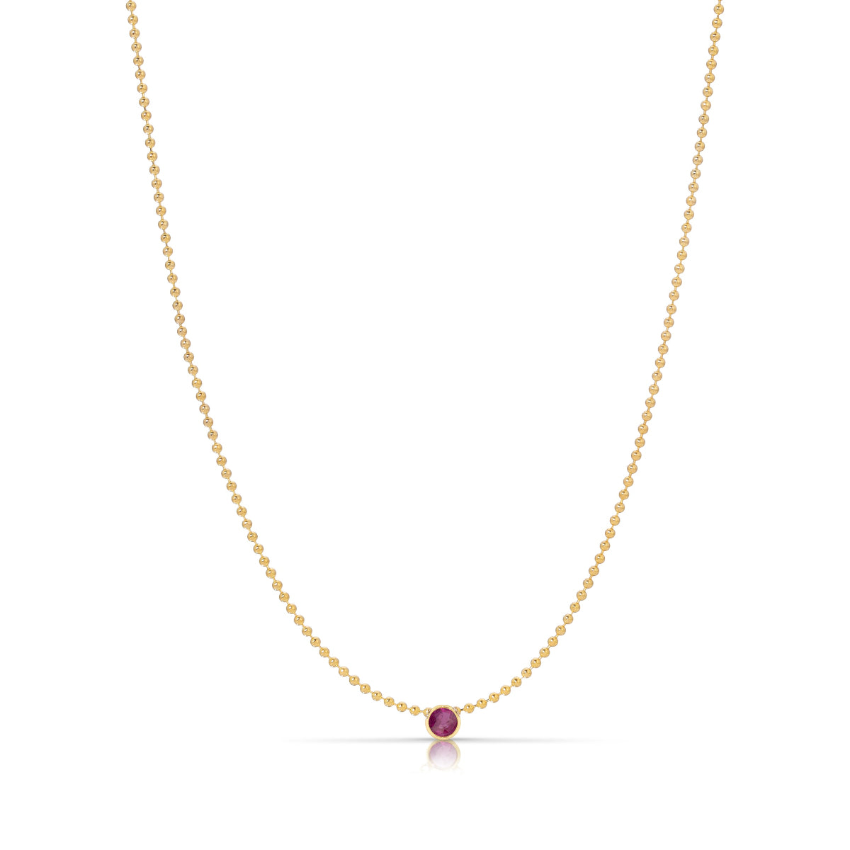A Single Birthstone Layering Necklace - Yellow Gold in Ruby - July on a white background.