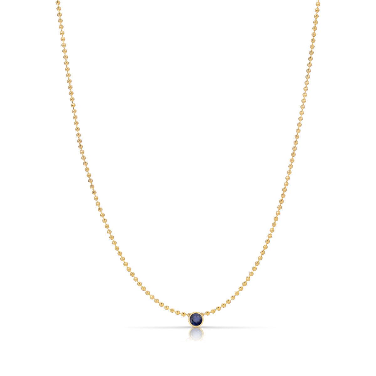A Single Birthstone Layering Necklace - Yellow Gold in Sapphire - September on a white background.