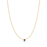 A Single Birthstone Layering Necklace - Yellow Gold in Sapphire - September on a white background.