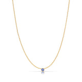 A Single Birthstone Layering Necklace - Yellow Gold in Tanzanite - December on a white background.