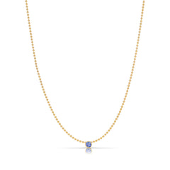A Single Birthstone Layering Necklace - Yellow Gold in Tanzanite - December on a white background.