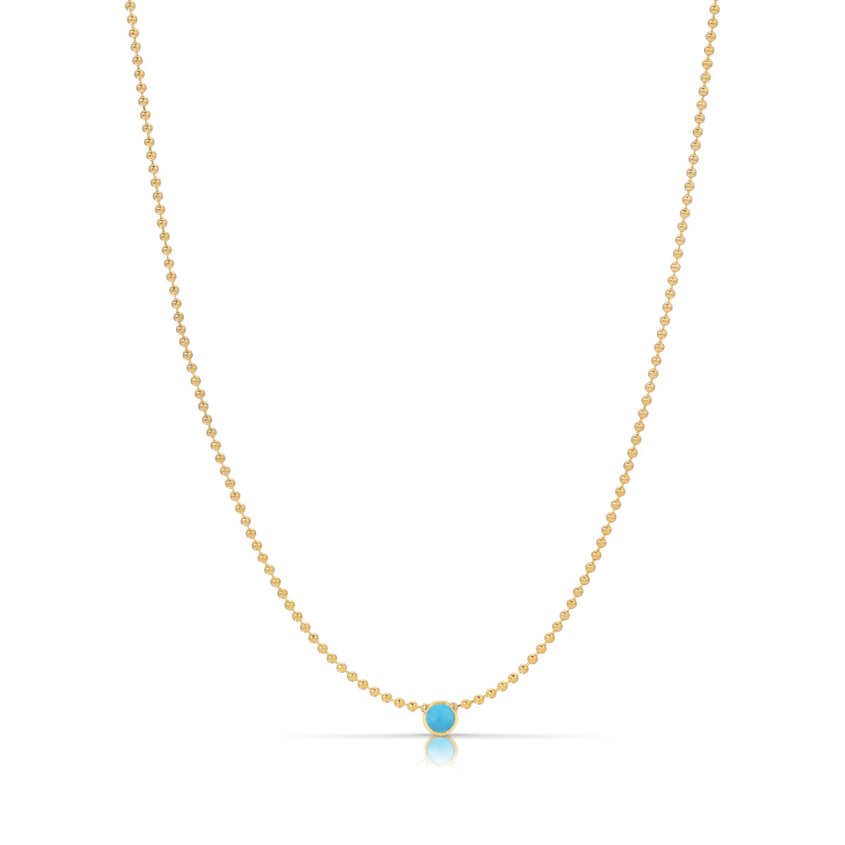 A Single Birthstone Layering Necklace - Yellow Gold in Turquoise - December on a white background.