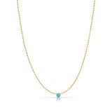 A Single Birthstone Layering Necklace - Yellow Gold in Turquoise - December on a white background.