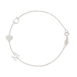 A white gold Custom Gold Bracelet – 3 Letters with the letters D and M and a heart charm, on a white background. 