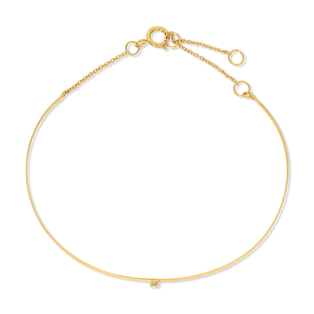 An Off the Cuff Bracelet in yellow gold on a white background. 