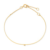 An Off the Cuff Bracelet in yellow gold on a white background. 